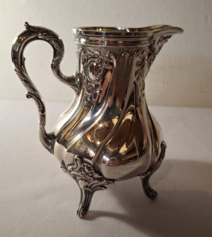 LOT 190 (32147) Est R1000 to R3000 – A 20th Century German Silver Rokoko-Stil footed Milk Jug