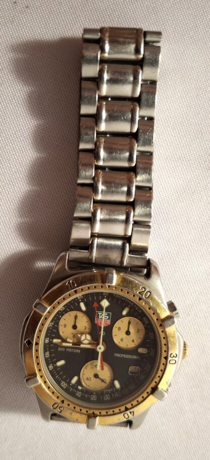 LOT 160 (3217412) Est R3000 to R6000 – A Swiss-made Tag Heuer Unisex Stainless Steel and Gold-plated 1/10 Chrono 200m Professional Date just Wristwatch, 2000 Series circa 1991