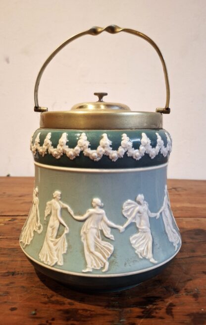 LOT 51 (32169160/1) Est R200 to R400 – A Late 19th – Early 20th Century Wiltshaw and Robinson Carlton Ware Tinted Faience Swing handle Biscuit Barrel with EPNS mounts and domed finialled cover