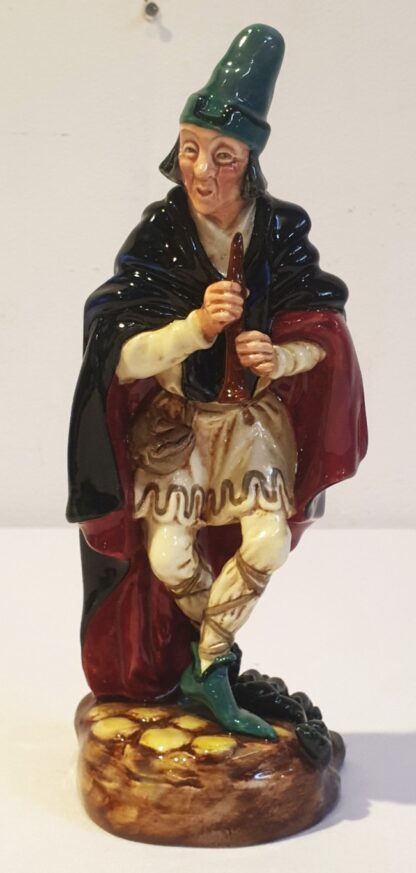 LOT 83 (31863151/16) Est R500 to R1500 – A Post-war Royal Doulton porcelain Figurine, The Pied Piper (Black, red and pale yellow colourway)