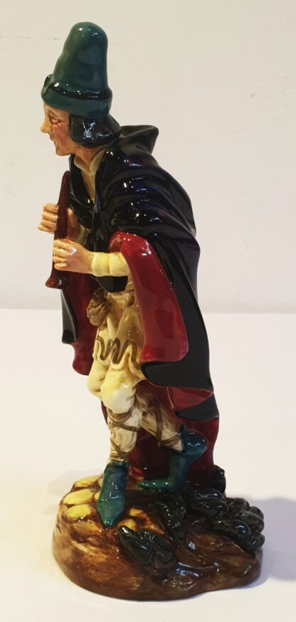 LOT 83 (31863151/16) Est R500 to R1500 – A Post-war Royal Doulton porcelain Figurine, The Pied Piper (Black, red and pale yellow colourway) - Image 2