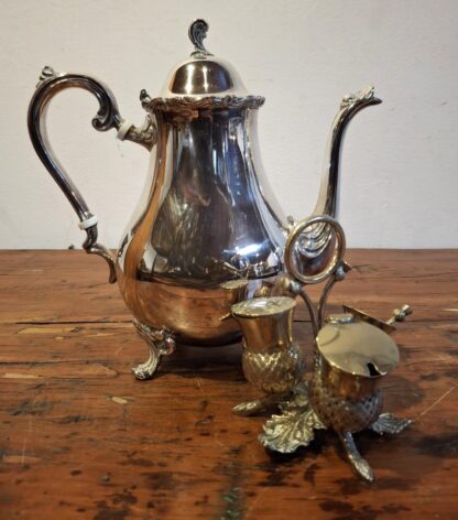 LOT 32 (32178158) Est R300 to R600 – A Novelty Late Victorian Electroplate on Brass Breakfast Cruet Set